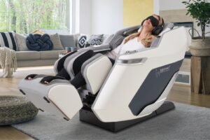 woman in massage chair Casada pollux white with braintronics headphones