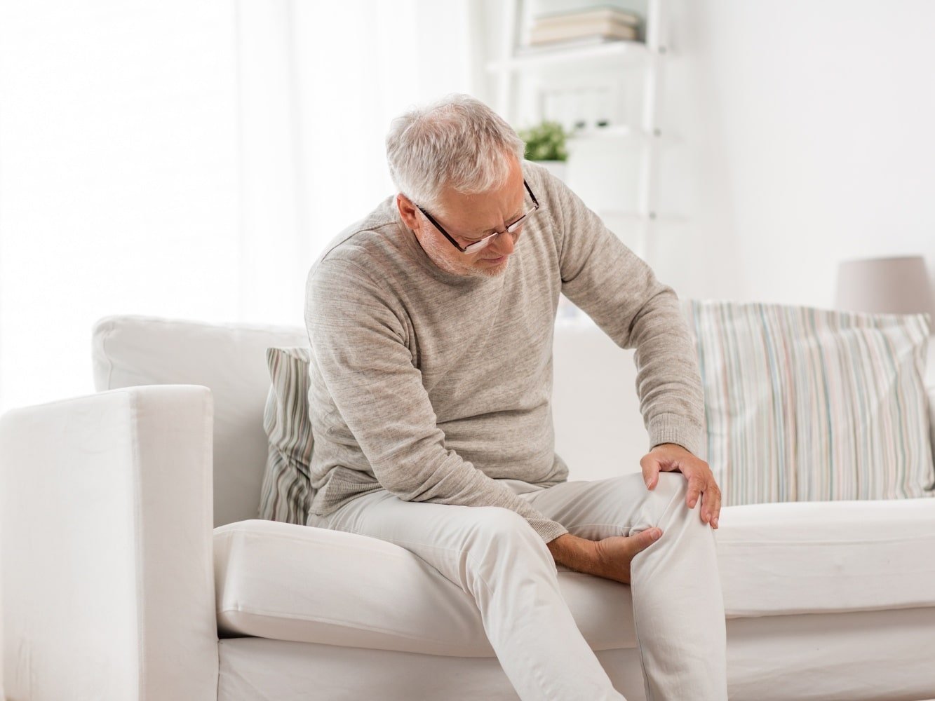 man with Muscular Rheumatism symptoms in seat